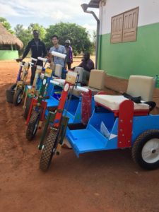 Huy-Liêm with Maurice, one of the volunteers who has been helping distribute the pedal carts throughout Benin.