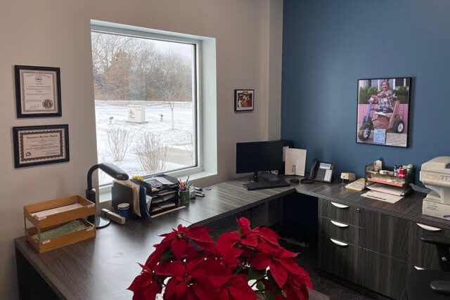 Office Main Volunteer Desk With Hung Pictures 2021 Feb